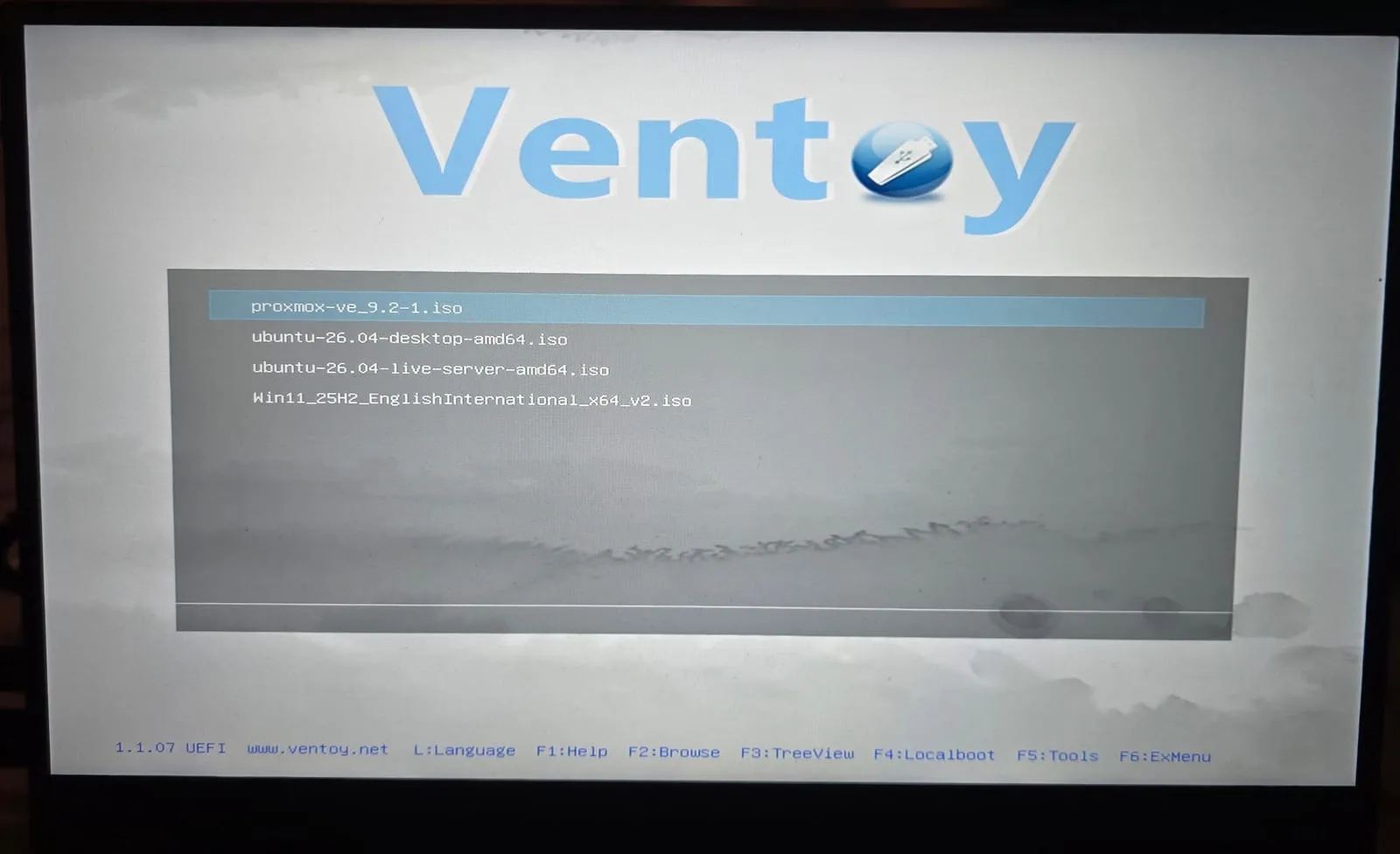 The Ventoy boot menu listing proxmox-ve_9.2-1.iso, two Ubuntu 26.04 ISOs and a Windows 11 ISO
